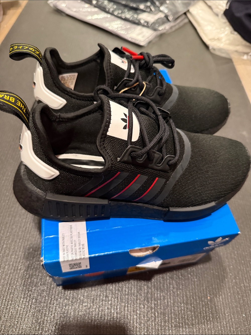 adidas NMD_R1 Black Sneaker with Red Stripes
